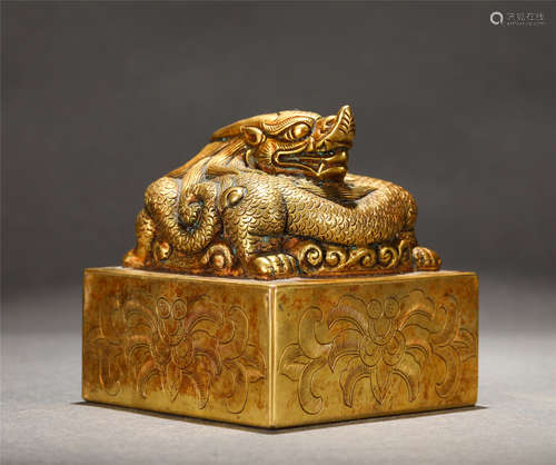 A GILT-BRONZE  BEAST SEAL