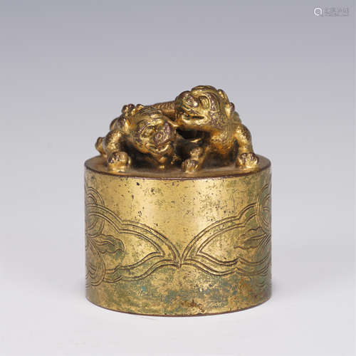 A GILT-BRONZE BEAST SEAL