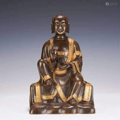 A BRONZE PARCEL GILT SEATED ARHAT