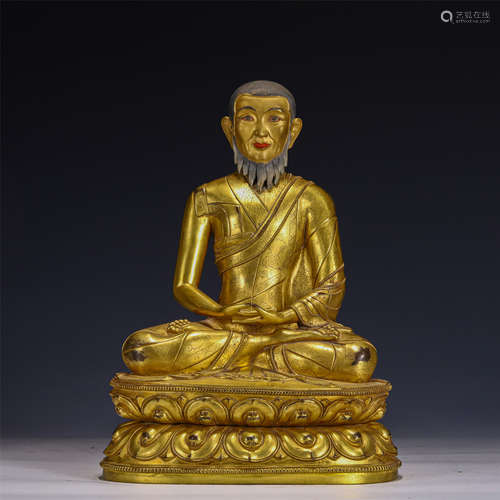 A GILT-BRONZE FIGURE OF MASTER GURU