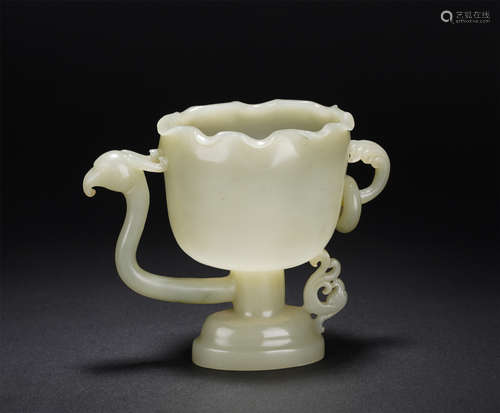 A CARVED WHITE AJDE WINE VESSEL