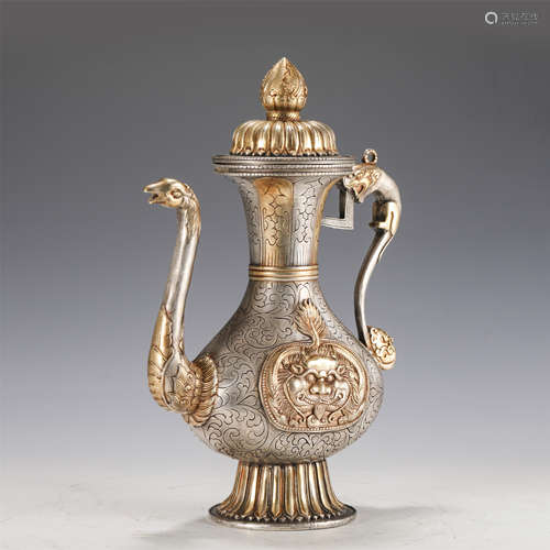 A SILVER GILT EWER