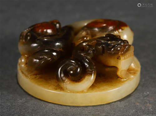 A CARVED RUSSET JADE ORNAMENT