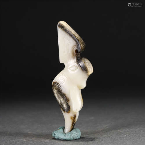 A CARVED WHITE AND RUSSET JADE ORNAMENT