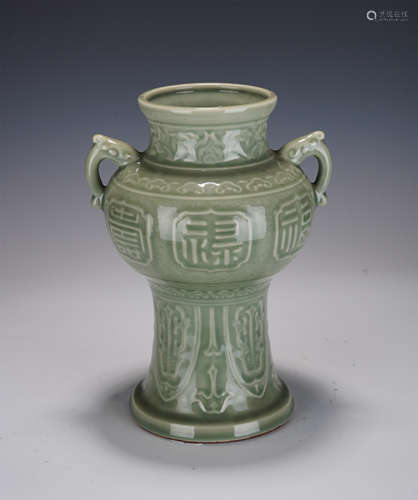 A CELADON GLAZED VASE WITH DOUBLE HANDLES