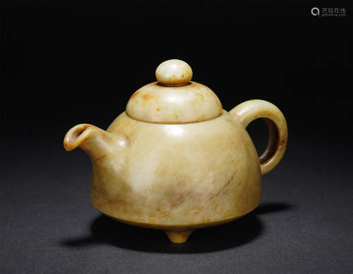 A CARVED CREAMY JADE TEAPOT