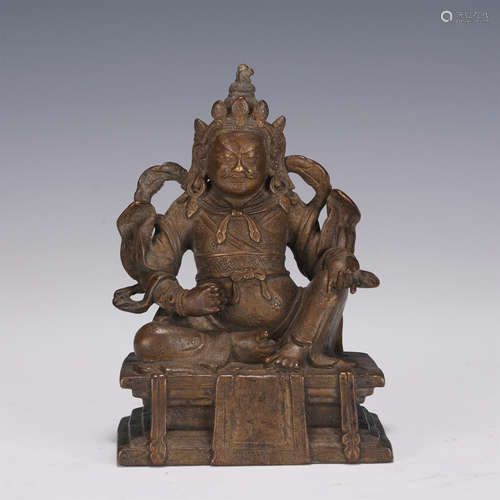 A CARVED BRONZE SEATED JAMBHALA