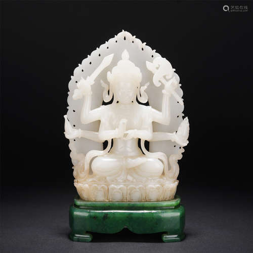 A CARVED WHITE JADE BODHISATTVA WITH SPINACH GREEN JADE STAN...