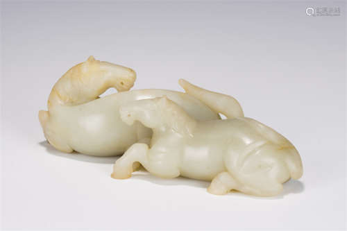 A CARVED WHITE JADE HORSES GROUP QING DYNASTY