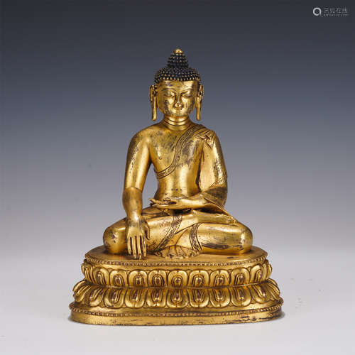 A GILT-BRONZE FIGURE OF SHAKYAMUNI