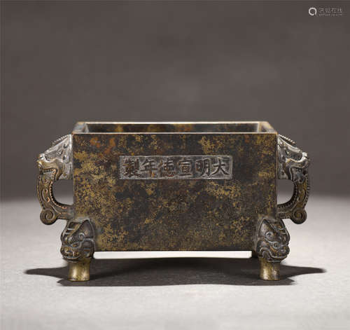 A BRONZE CENSER WITH DOUBLE HANDLES