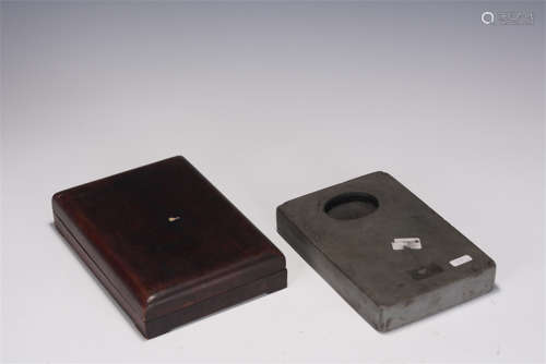 AN INKREST WITH WOODEN BOX