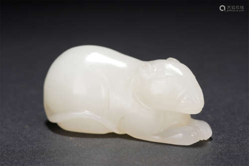 A CARVED WHITE JADE MOUSE