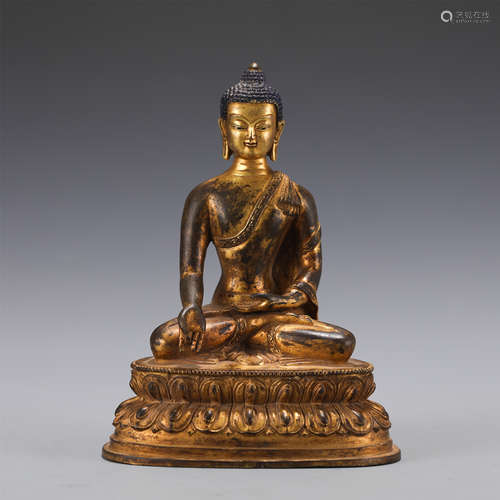 A GILT-BRONZE FIGURE OF SHAKYAMUNI