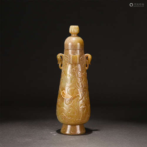 A CARVED CREAMY JADE ZUN VASE