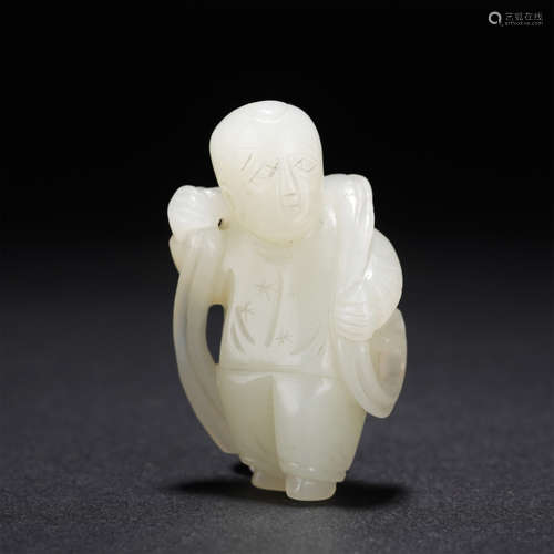 A CARVED WHITE JADE STANDING KID