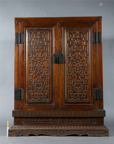 A CARVED HUANGHUALI CABINTET