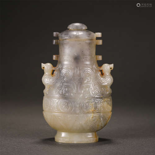 A CARVED JADE VASE