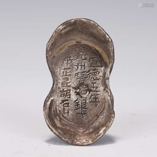 AN INSCRIBED SILVER INGOT