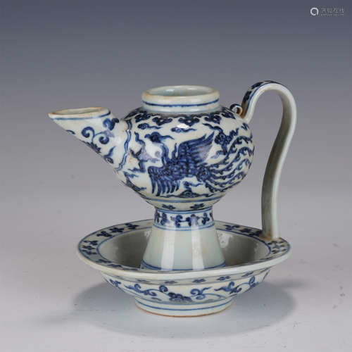 A BLUE AND WHITE PHOENIX EWER