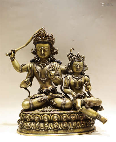 A BRONZE SEATED MANJUSRI WITH ACOLYTE