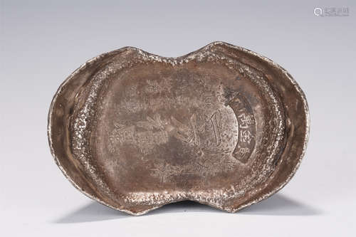 AN INSCRIBED SILVER INGOT