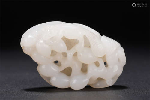 A CARVED WHITE JADE SQUIRREL AND GRAPEFRUITS