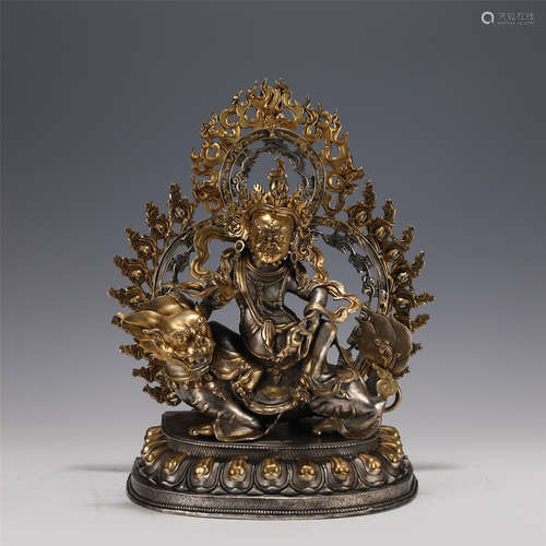 A GILT-BRONZE FIGURE OF JAMBHALA