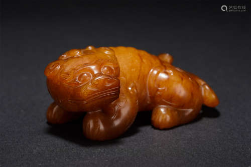 A CARVED RUSSET JADE BEAST