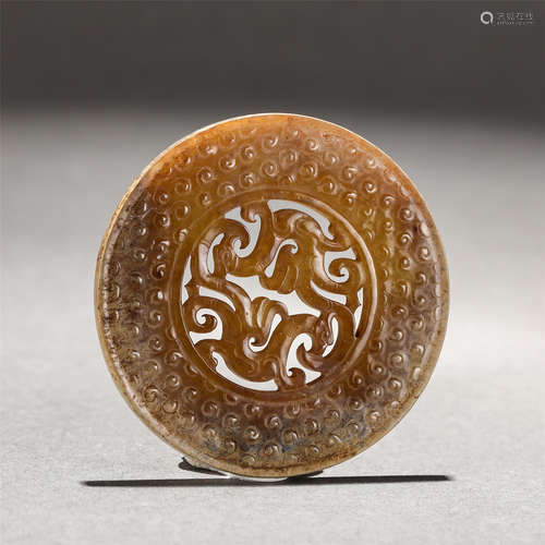 A CARVED RUSSET JADE DECORATION