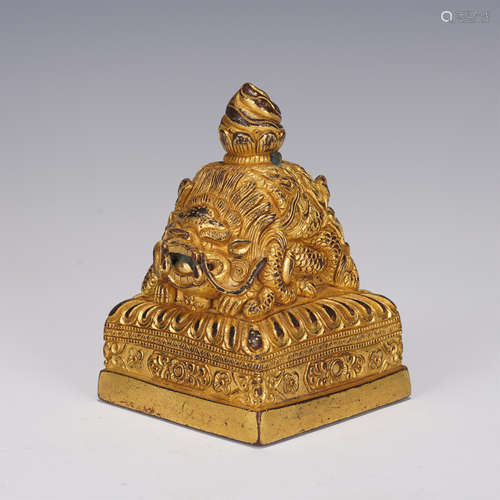 A TIBETAN GILT-BRONZE BEAST SEAL