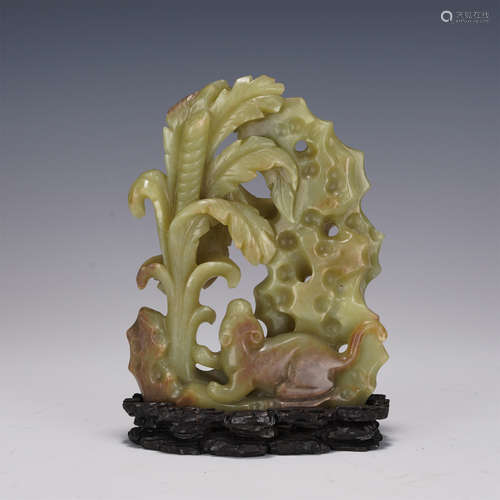 A CARVED YELLOW JADE DECORATION