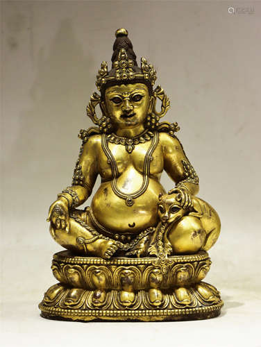 A BRONZE SEATED JAMBHALA DENSATIL STYLE