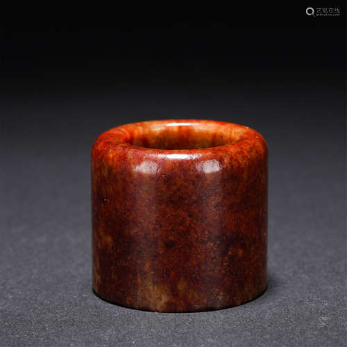 A RUSSET JADE ARCHERS RING