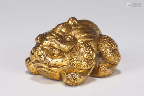 A GILT-BRONZE BEAST PAPER WEIGHT