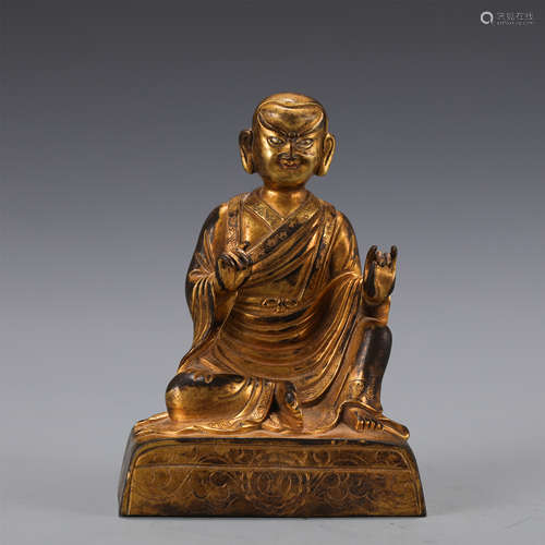 A GILT-BRONZE FIGURE OF MASTER GURU