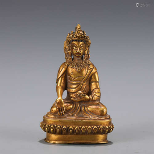 A GILT-BRONZE FIGURE OF BHAIYAJYAGURU