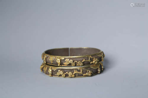 A Pair Of Gilt Bronze Relief-Decorated Bracelets