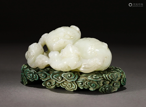 A CARVED WHITE JADE BEASTS GROUP