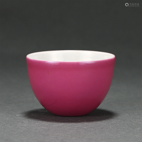 A PINK ENAMELED CUP