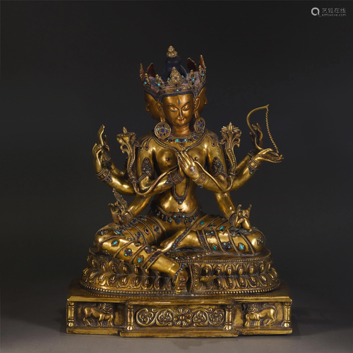 A TURQUOISE INLAID GILT-BRONZE SEATED MULTI HANDS TARA