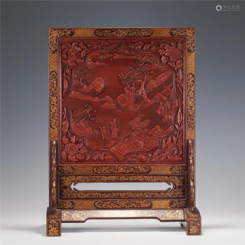 A CARVED CINNABAR LACQUER LANDSCAPE TABLE SCREEN