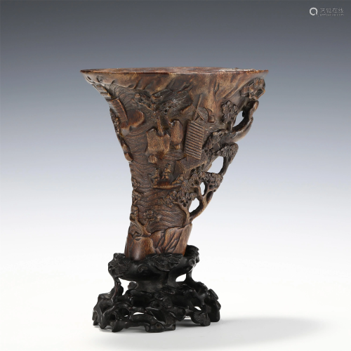 A CARVED CHENXIANG RHYTON WITH STAND