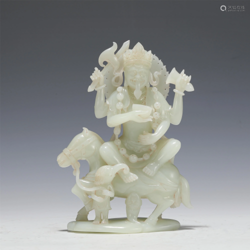 A CARVED WHITE JADE PROTECTOS