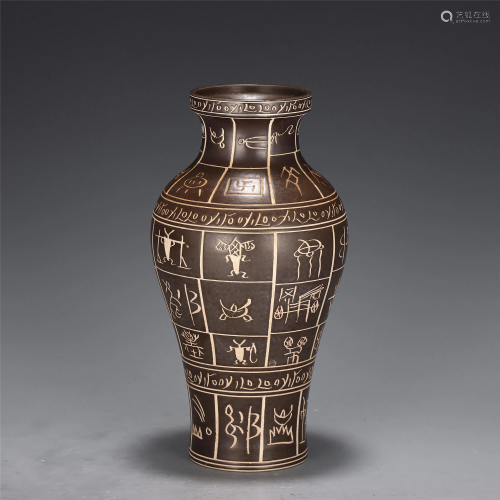AN INCISED POTTERY VASE