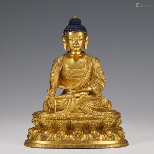 A GILT-BRONZE SEATED SHAKYAMUNI