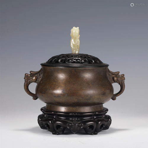 A BRONZE CENSER WITH DOUBLE HANDLES