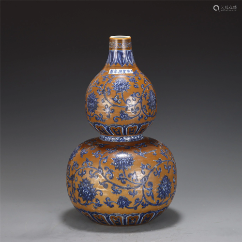 A YELLOW GROUND AND UNDERGLAZE BLUE DOUBLE GOURD…