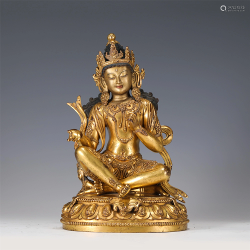 A GILT-BRONZE SEATED PROTECTOR