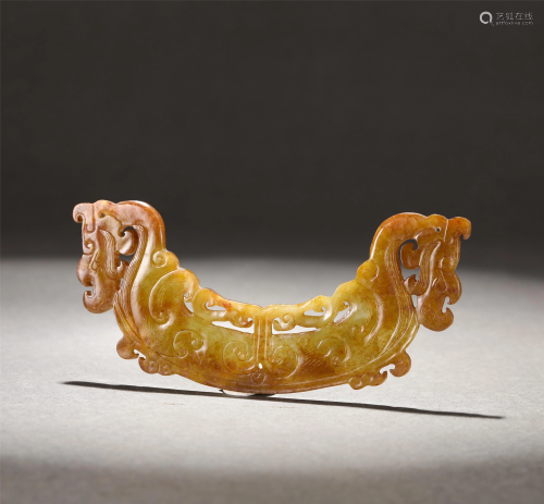 A CARVED YELLOW JADE DRAGON HUANG